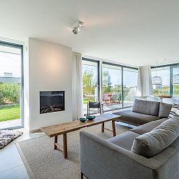 Cozy sitting area with fireplace in Waterline 09, vacation home in Kamperland, Zeeland.