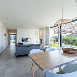 Dining area with designer lamps in Waterline 09, vacation home in Kamperland, Zeeland.