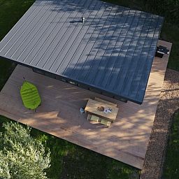 Aerial view of vacation home in Kamperland, surrounded by greenery and tranquility in North Beveland, Zeeland.