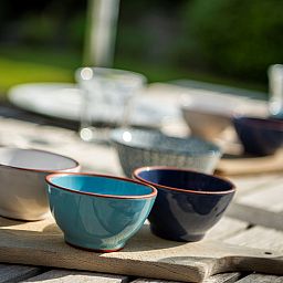 Detail of tableware on the terrace of Holiday home Schouwse Duin 35 in Burgh-Haamstede, ideal for outdoor dining.
