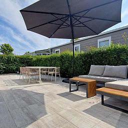 Spacious terrace with comfortable seating at VZ2326 Holiday Chalet Stern 1866 Renesse in Renesse, Schouwen-Duiveland.