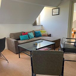 Cozy living room in VZ034 Apartment Koudekerke, vacation home in Koudekerke, Walcheren, with comfortable seating.