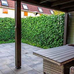 Luftige Aussicht auf das Wohnzimmer des Ferienhauses ZE1402 in Oostkapelle, Walcheren, Zeeland.