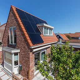 Dining area with terrace view in vacation home ZE1508, Westkapelle, Walcheren, Zeeland.