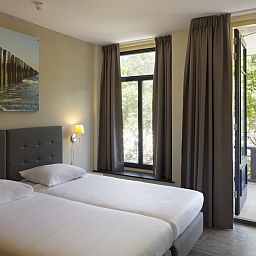 Schlafzimmer mit Balkon in Bordeaux Wellness 4 Wohnung Domburg, Walcheren, Zeeland.