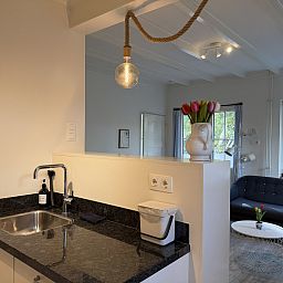 Attractive bedroom in vacation home ZE1541, Zoutelande, Walcheren with comfortable bed and view of green garden.