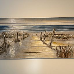 Cozy living room in vacation home ZE1541, Zoutelande, Walcheren, overlooking green nature through large windows.