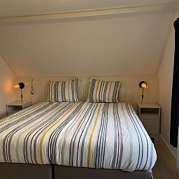 Vacation home ZE1541 in Zoutelande, Walcheren, Zeeland with charming brick facade and attractive terrace, ideal for a relaxing stay.