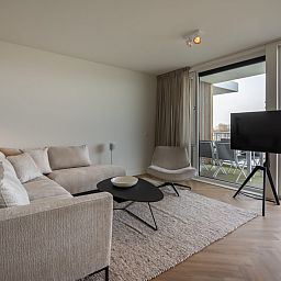 Comfortable sitting area in Lamsoor 47 | Veerse Wende, vacation home in Arnemuiden, Walcheren, Zeeland with balcony.