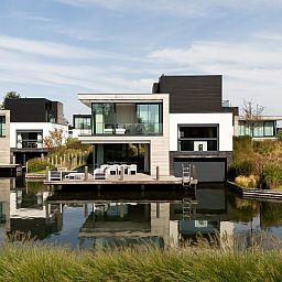 Detached house in Arnemuiden, beautiful waterfront vacation home on Walcheren, Zeeland, with modern architecture and serene surroundings.