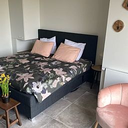 Attractive bedroom in Holiday Home in Vrouwenpolder, Walcheren, Zeeland with elegant interior.