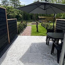 Cozy terrace of VZ1022 Holiday apartment in Veere, Walcheren, Zeeland overlooking the garden.