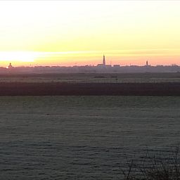 Adembenemend uitzicht op de zonsopgang vanuit Vakantiehuis in Grijpskerke, Walcheren, Zeeland.