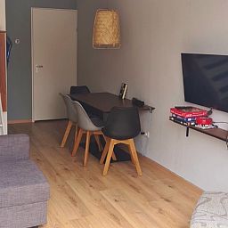 Modern interior of Holiday home in Breskens, Zeeuws-Vlaanderen. Comfortable sitting area and dining area in this vacation home.