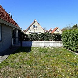 Spacious garden at VZ921 Holiday home in Cadzand-Bad, ideal for relaxation in Zeeland.