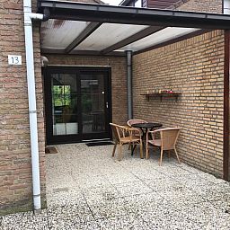 Ueberdachte Terrasse im Ferienhaus VZ919 in Retranchement, ideal fuer entspannende Momente in Zeeland.