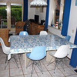 Dining room in Vermare vacation home, Wemeldinge, South Beveland, with spacious table and stylish chairs.