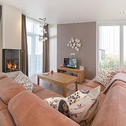 Helles Wohnzimmer im Ferienhaus Waterresort Oosterschelde Haus Nr. 93 in Wemeldinge, ideal fuer Familien.