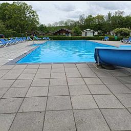 Relax by the refreshing pool of vacation home Scheldeoord 54 in Baarland, South Beveland, ideal for a summer vacation in Zeeland.