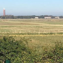 Landschap met vuurtoren nabij Vakantiehuis in Ouddorp, Goeree-Overflakkee, Zuid-Holland.