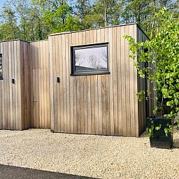 Exterior of House in Ouddorp, a vacation home in Ouddorp, South Holland surrounded by nature.