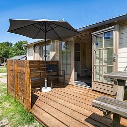 Enjoy the sun on the veranda of Camping Chalet the Albatros Plus in Ouddorp, Goeree-Overflakkee, South Holland.