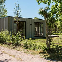 Duunroos vacation home in Ouddorp with sunny terrace and natural surroundings.