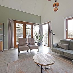 Bright living room of Detached house in Reeuwijk, vacation home in the Green Heart, South Holland, with modern furnishings and views of terrace.