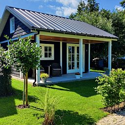 Sunny terrace at Holiday Home in Nieuwveen, Green Heart, South Holland.