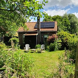 Cozy garden at Holiday home in Oostvoorne, ideal for relaxation in Voorne Putten.