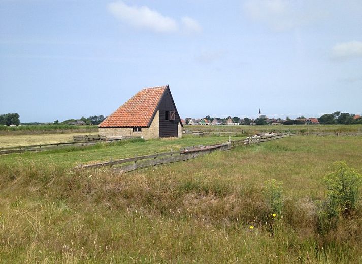 Gezellige woonkamer van Ons Eilandgevoel in De Cocksdorp, Texel, met comfortabele zitruimte.