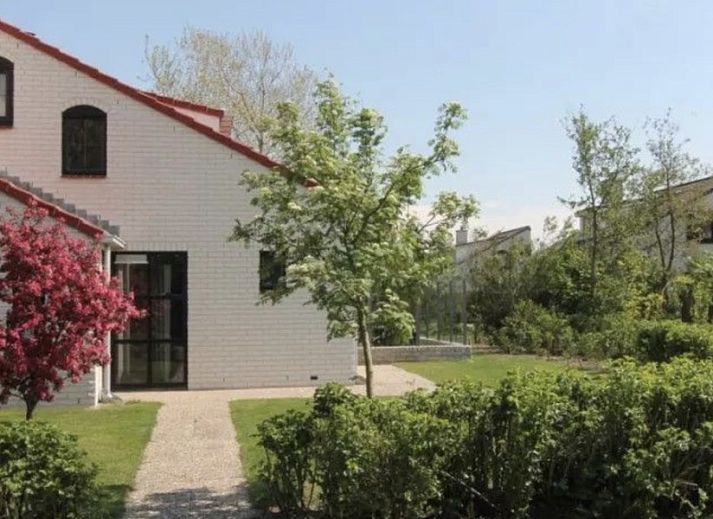 Ferienperle vacation home with flowering tree in De Cocksdorp, Texel, Wadden Islands.