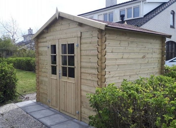 Ferienperle vacation home with flowering tree in De Cocksdorp, Texel, Wadden Islands.