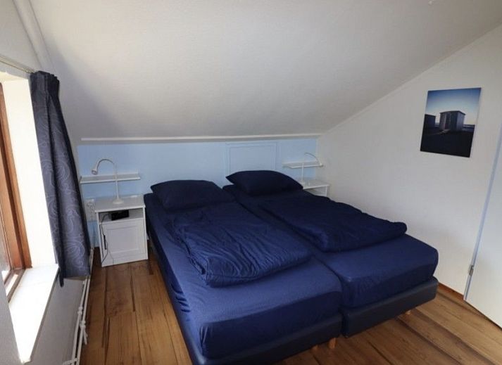 Ferienperle vacation home in De Cocksdorp, Texel, with garden and natural surroundings.