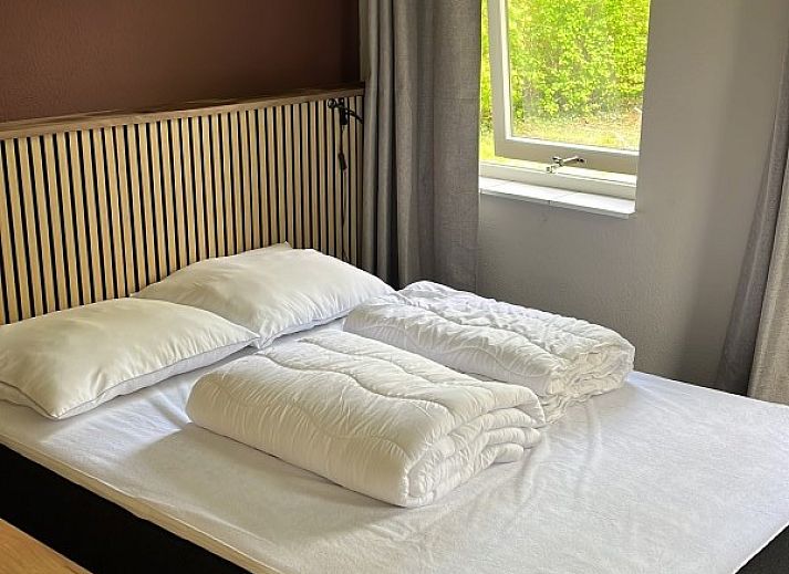 Stijlvolle woonkamer van TXL Huisje 299 in De Cocksdorp, Texel. Comfortabel vakantiehuis met moderne inrichting en veel natuurlijk licht.