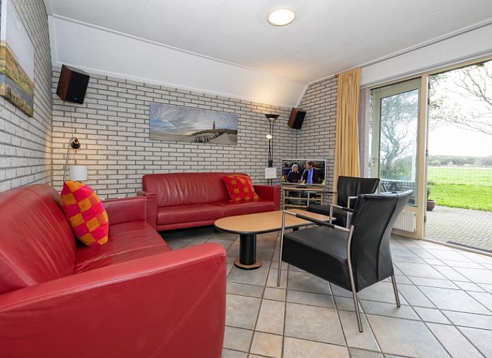 Vakantiehuis Schelpenoord 129 met charmant terras in De Cocksdorp, Texel, ideaal voor ontspannen verblijf op de Waddeneilanden.