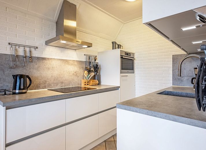 Vakantiehuis Schelpenoord 129 met charmant terras in De Cocksdorp, Texel, ideaal voor ontspannen verblijf op de Waddeneilanden.