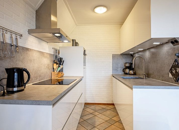 Vakantiehuis Schelpenoord 129 met charmant terras in De Cocksdorp, Texel, ideaal voor ontspannen verblijf op de Waddeneilanden.