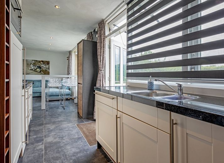 Relax on the terrace of Bungalow Duin aan Zee Texel in the picturesque Bungalowpark Tamarisk, De Cocksdorp.