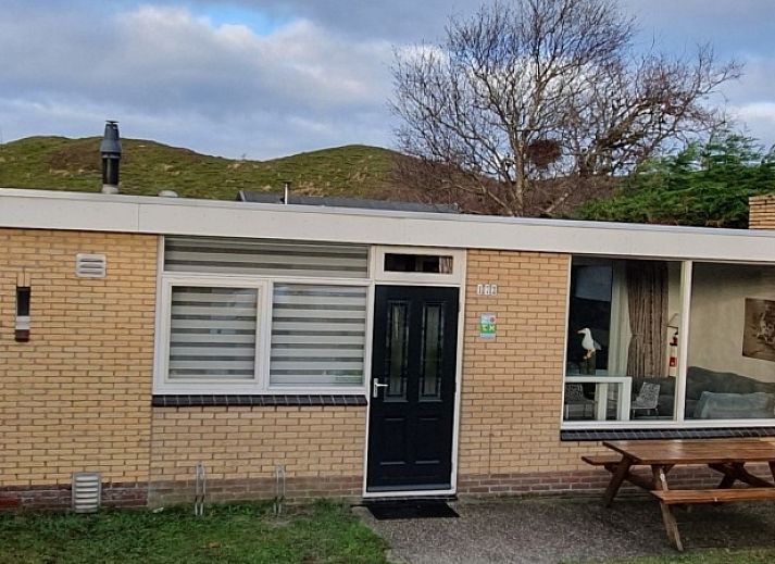 Relax on the terrace of Bungalow Duin aan Zee Texel in the picturesque Bungalowpark Tamarisk, De Cocksdorp.