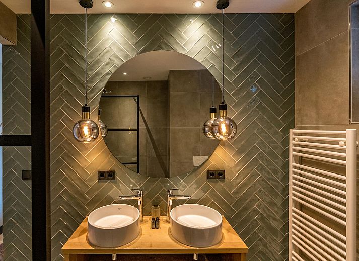 View from the living room of Princenhof 1 - 6-pers in De Cocksdorp, Texel with modern furnishings and terrace.