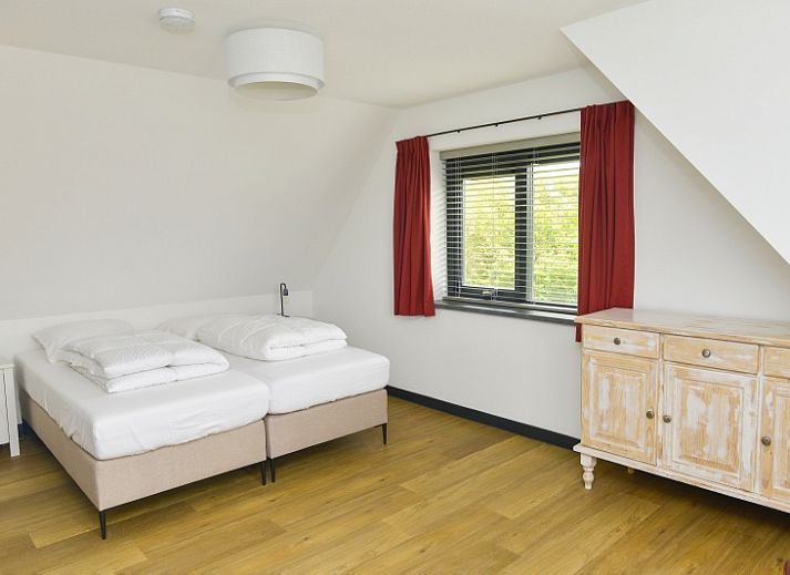 Vooraanzicht van De Postschipper vakantiewoning in De Cocksdorp, Texel, met charmante entree.