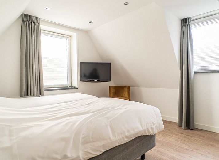 Lichte woonkamer van Type D Kikkertstraat in De Cocksdorp, Texel, vakantiehuis met comfortabele inrichting.