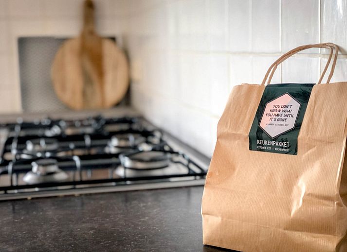 Cozy living room of Holiday home De Vuurtoren in De Cocksdorp Texel with modern furnishings.