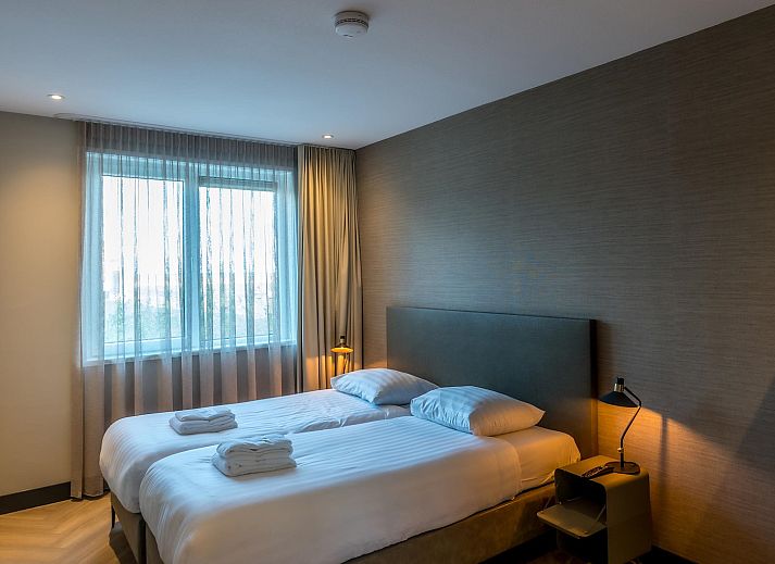 Modern living room in Princenhof 2, Texel, with comfortable seating and natural light.