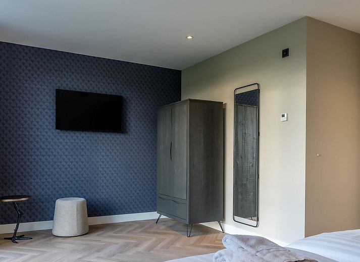 Cozy sitting area in Princenhof 2, vacation home on Texel with landscape views.