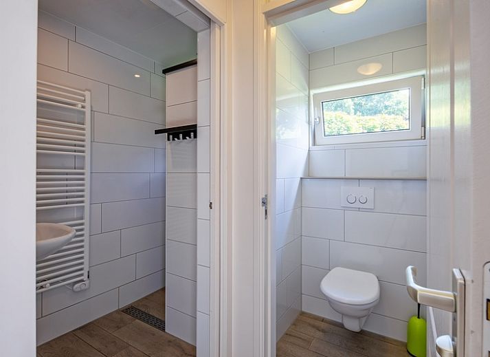 Bright living space of Holiday home Slufterhoek 174, Texel overlooking the garden in De Cocksdorp.