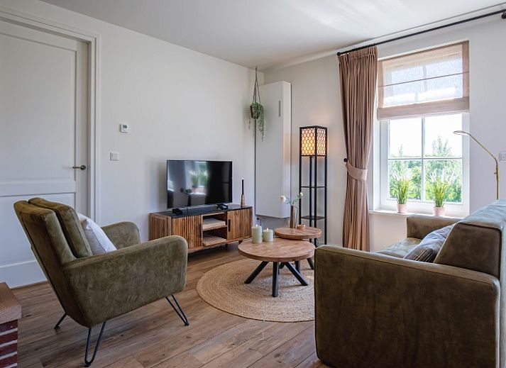 Apartment A in De Cocksdorp Texel with spacious garden and terrace for relaxation.