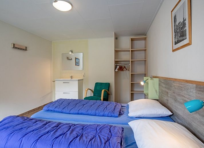 Geraeumiges Wohnzimmer des Ferienhauses Bungalow Tamarisk 206 in De Cocksdorp, Texel mit gemuetlicher Sitzecke.