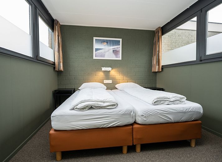 Vakantiehuis 34A in De Cocksdorp, Texel met zonnig terras en groene omgeving.